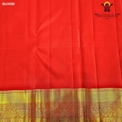 A rich bright vermilion red Saree
