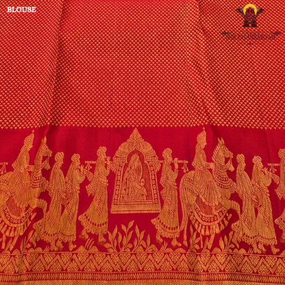 A vibrant bridal red color beautifully enhanced with rich gold zari weaving Saree