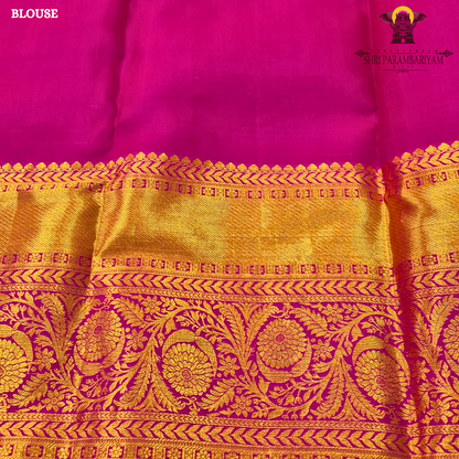 A refreshing parrot green body paired with a vibrant rani pink border Saree