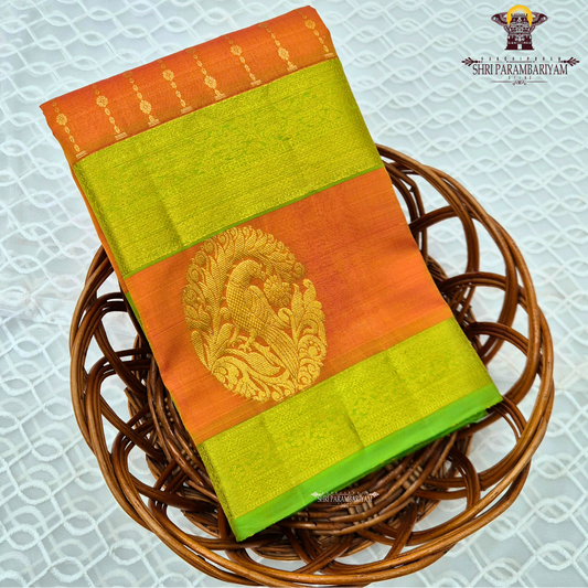 A vibrant orange body beautifully contrasted with a bright parrot green border Saree