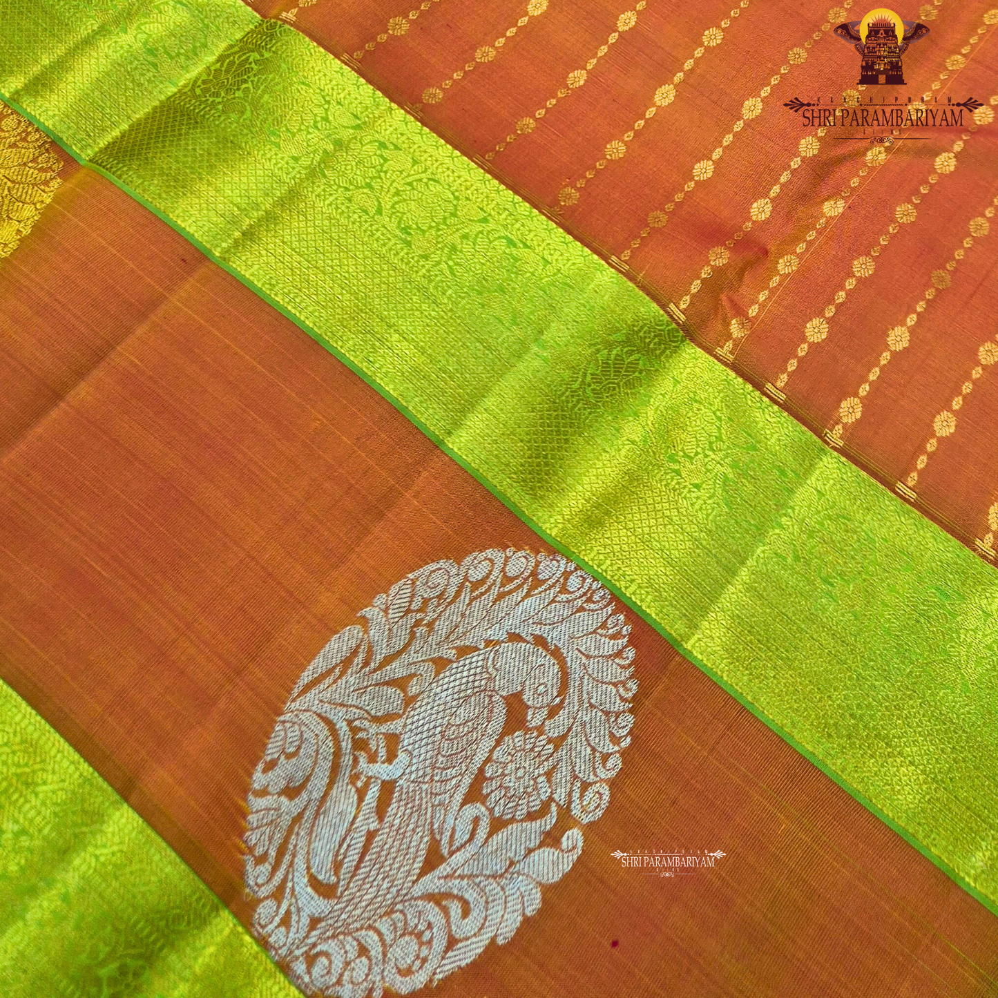 A vibrant orange body beautifully contrasted with a bright parrot green border Saree