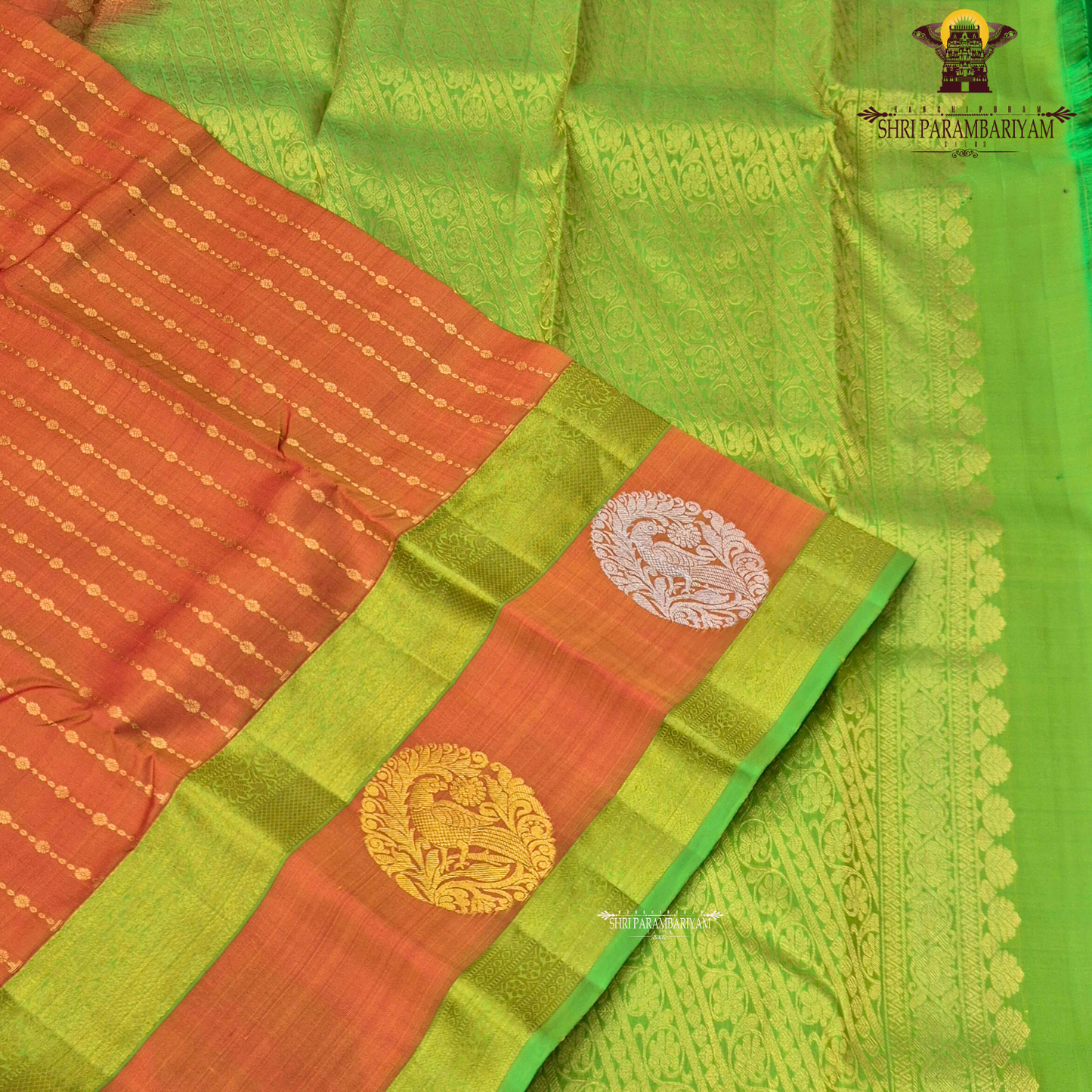 A vibrant orange body beautifully contrasted with a bright parrot green border Saree