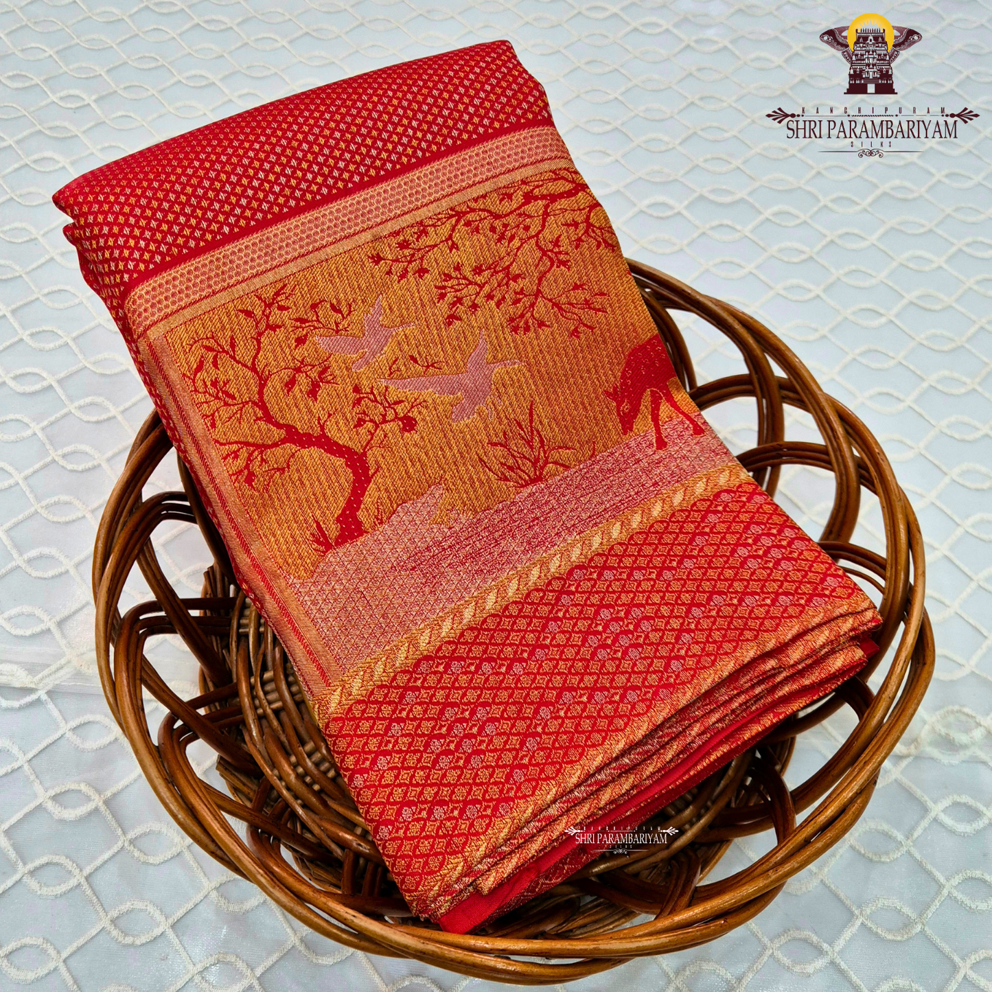 A vibrant bridal red color complemented by rich gold zari weaving Saree