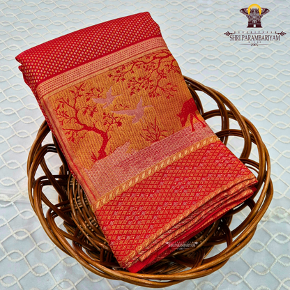 A vibrant bridal red color complemented by rich gold zari weaving Saree