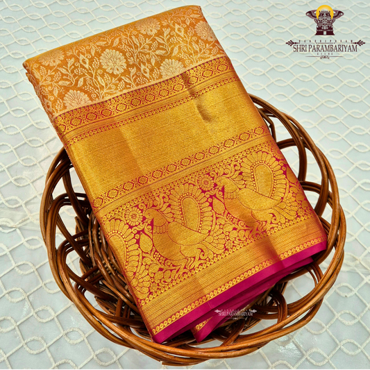 Rich mustard gold / honey gold with vibrant reddish-pink (rani pink) border Saree