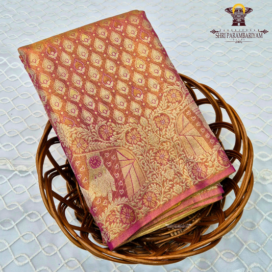 A shimmering copper-gold tissue base, giving the fabric a radiant and luxurious Saree