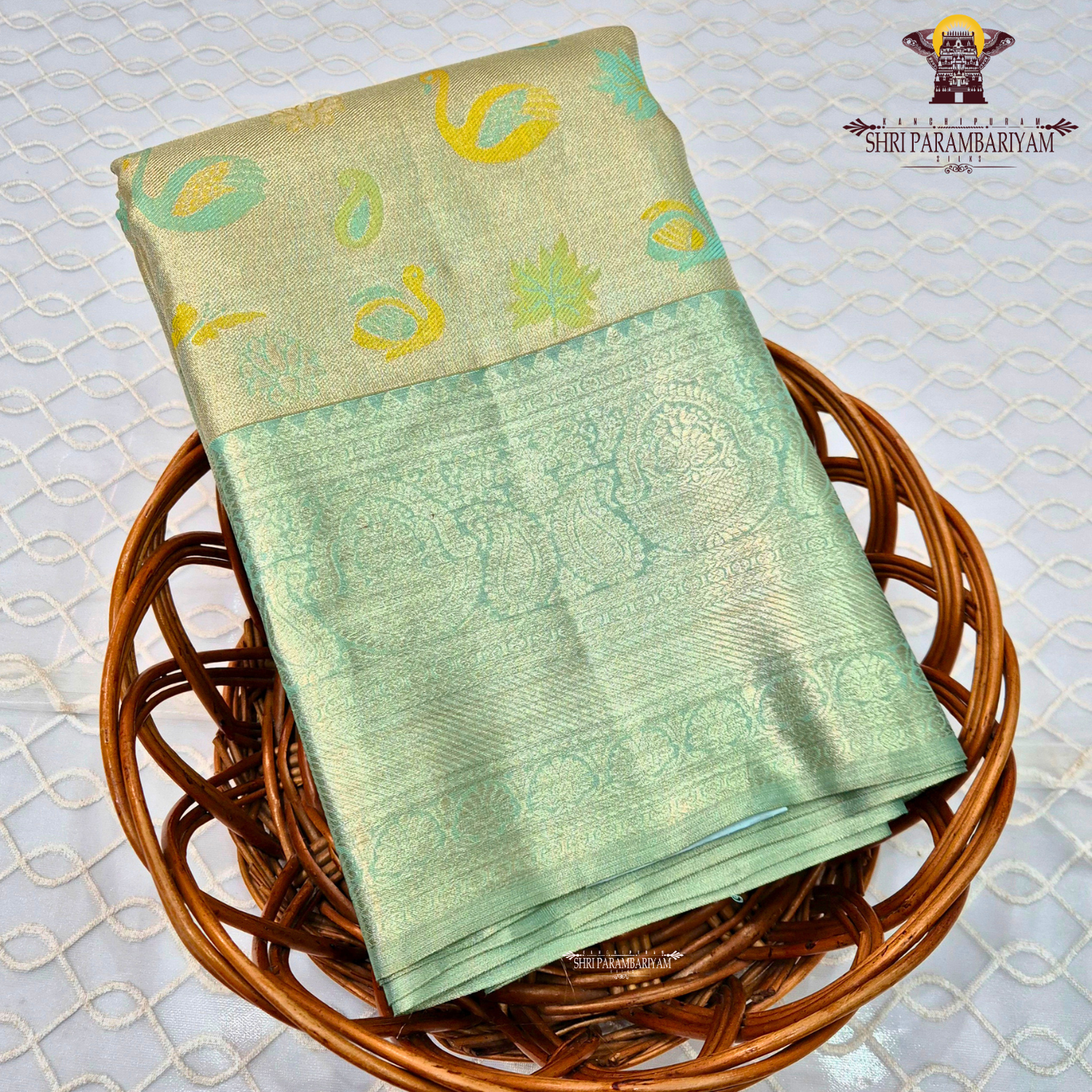 A soft and elegant pastel sea green / mint green tissue base Saree