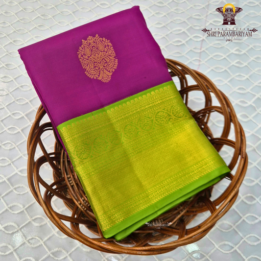 A stunning deep magenta (rani pink) and bright parrot green combination Saree