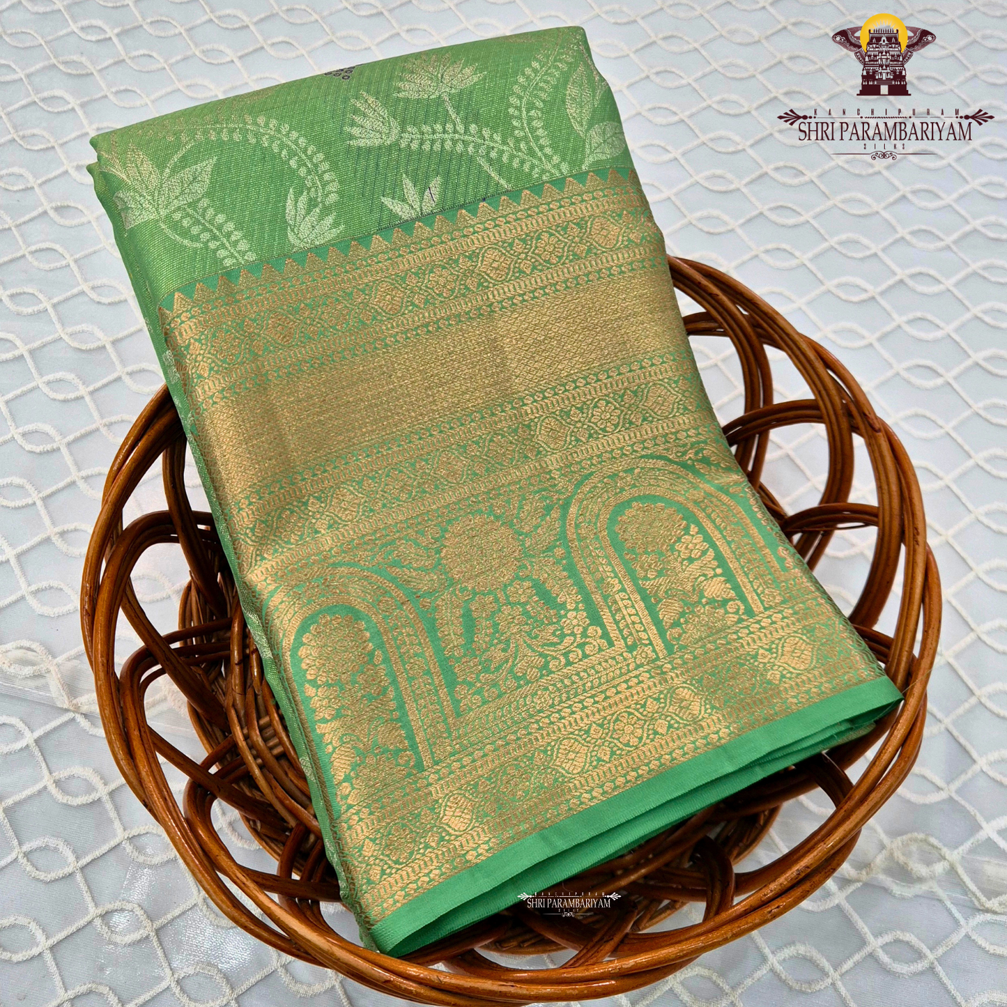 A refreshing parrot green / leaf green base with rich antique gold zari work Saree