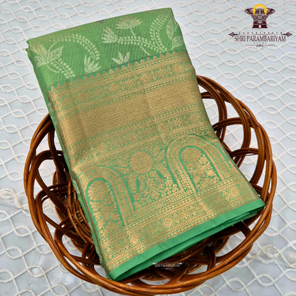 A refreshing parrot green / leaf green base with rich antique gold zari work Saree