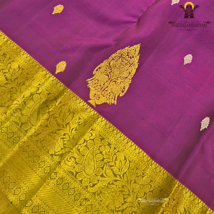 Rich royal purple (magenta-violet tone) with a contrasting antique gold zari border Saree