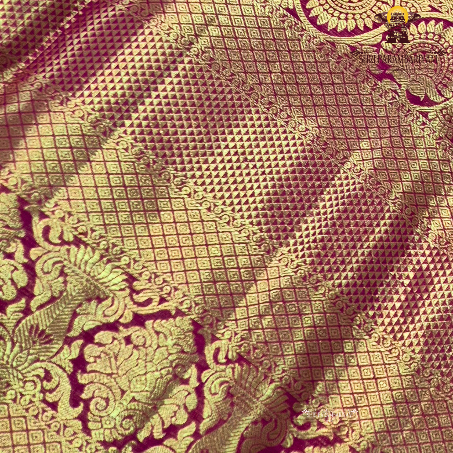 A rich and regal deep magenta / rani pink base adorned with opulent antique gold zari work Saree