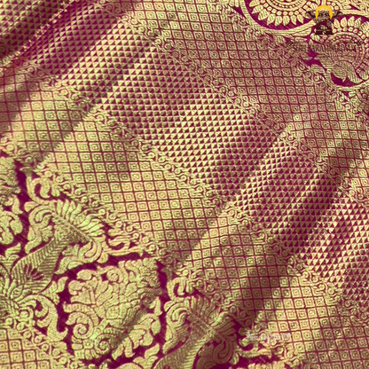 A rich and regal deep magenta / rani pink base adorned with opulent antique gold zari work Saree