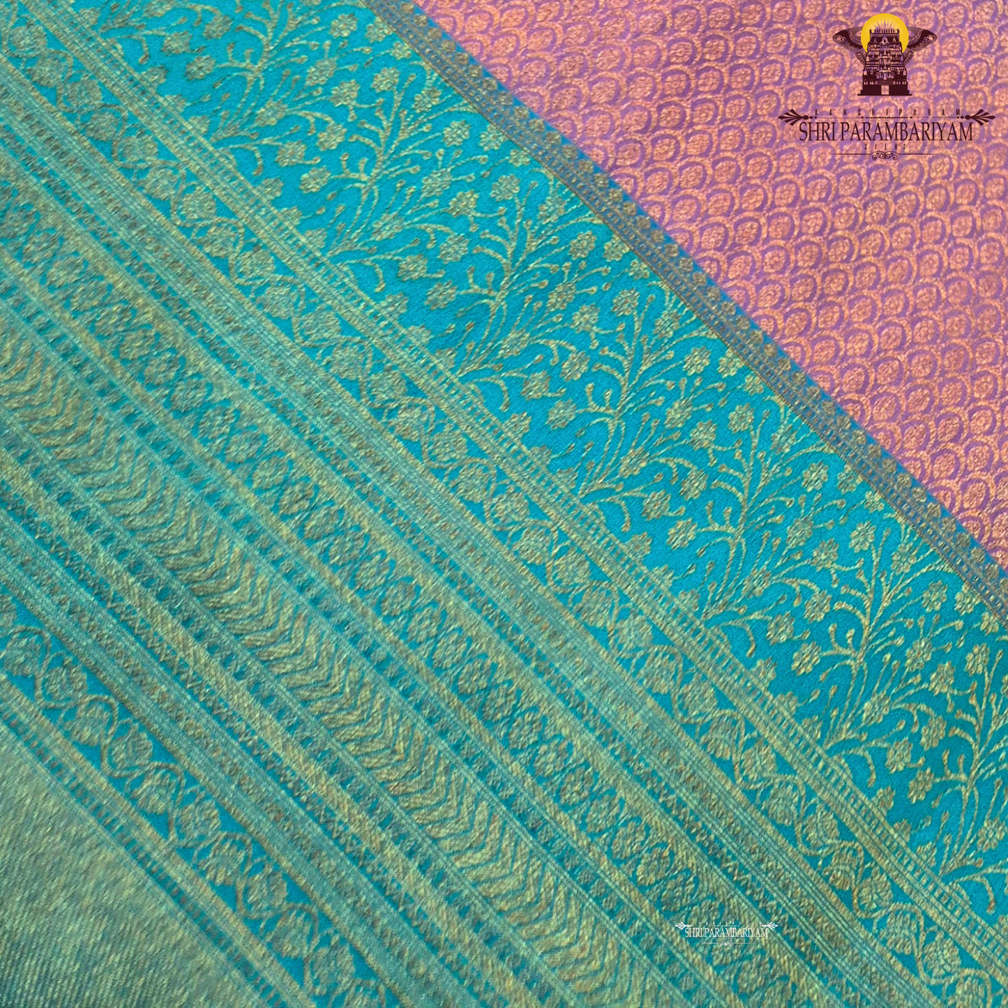 A beautiful combination of lavender (light purple) body with a contrasting turquoise blue (peacock blue) Saree