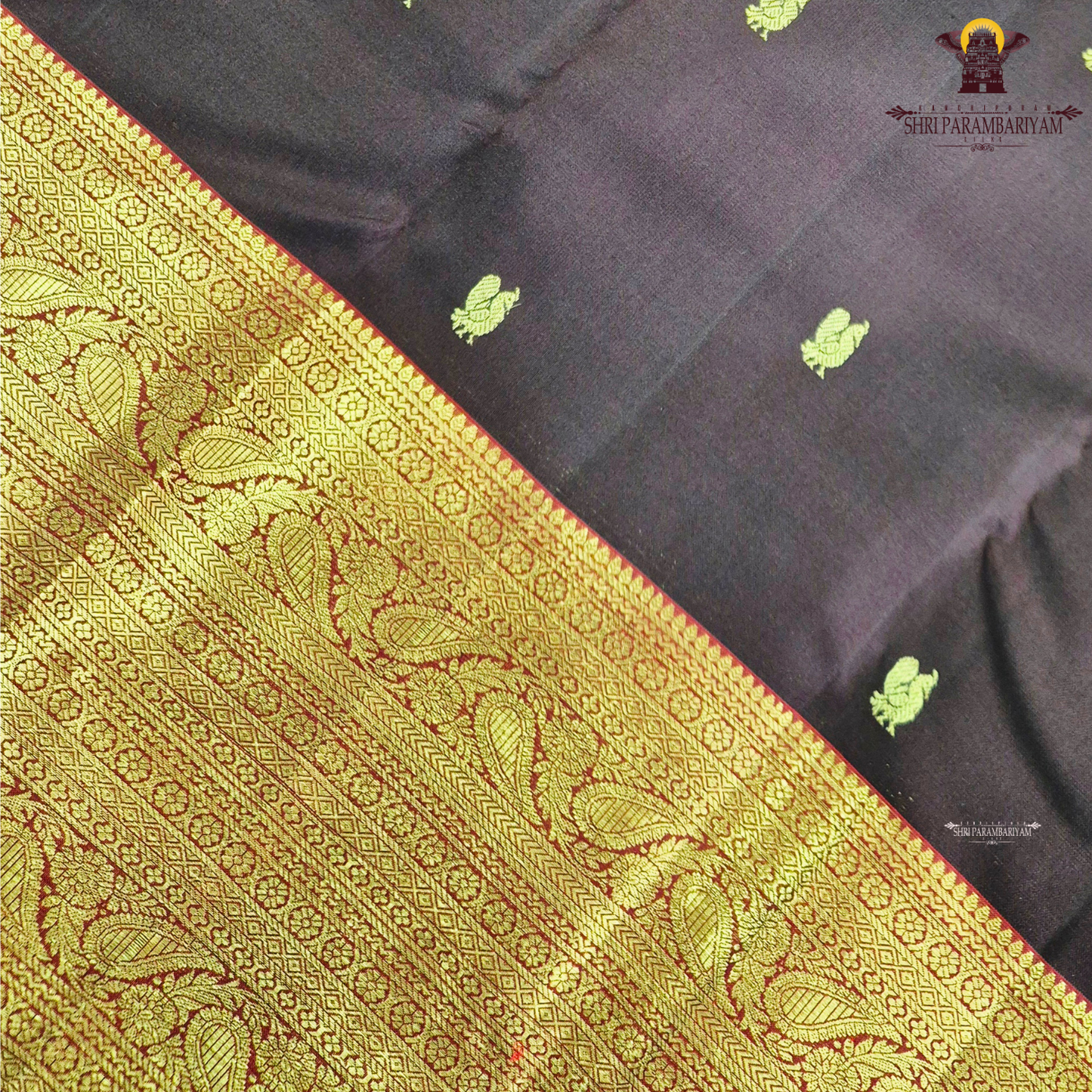 A luxurious deep black grape shade, adorned with delicate gold zari Saree