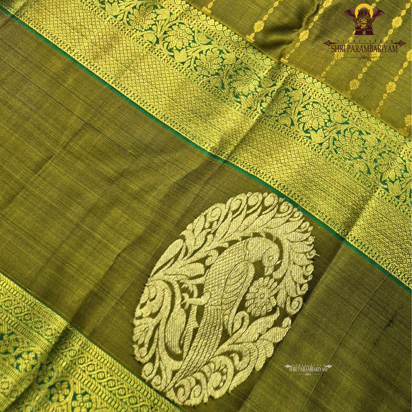 A rich olive green (mehendi green) shade, beautifully highlighted with intricate Saree