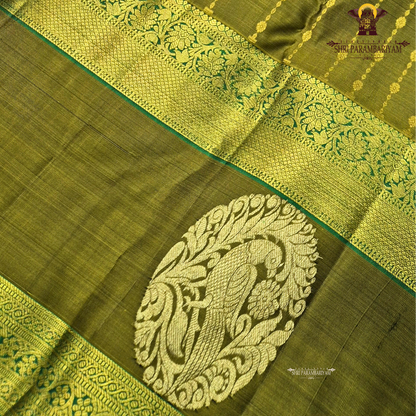 A rich olive green (mehendi green) shade, beautifully highlighted with intricate Saree
