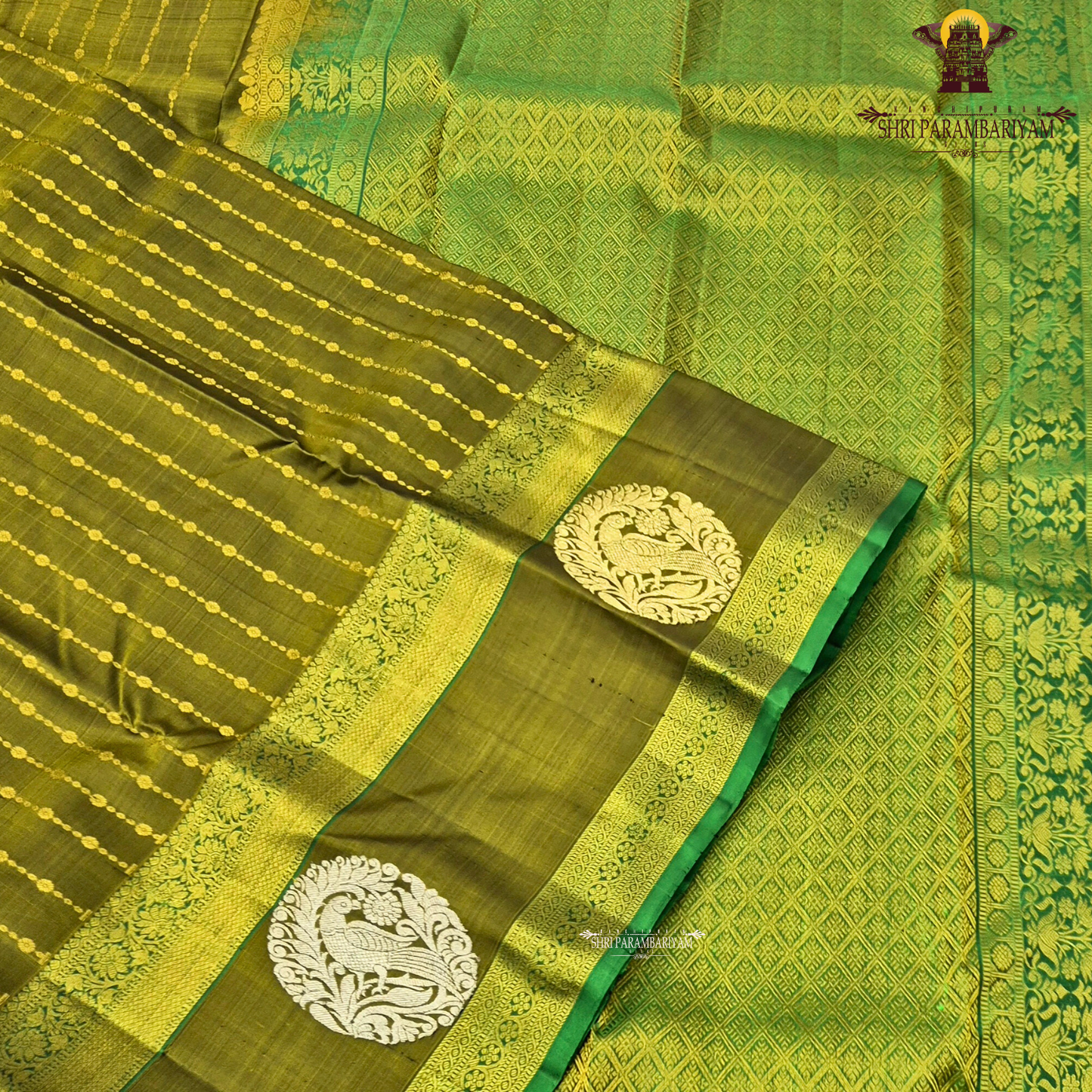 A rich olive green (mehendi green) shade, beautifully highlighted with intricate Saree