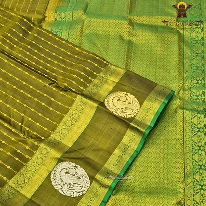A rich olive green (mehendi green) shade, beautifully highlighted with intricate Saree