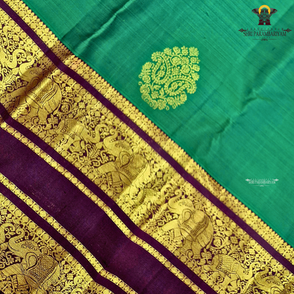 A rich Emerald Green with Royal Purple Border Saree