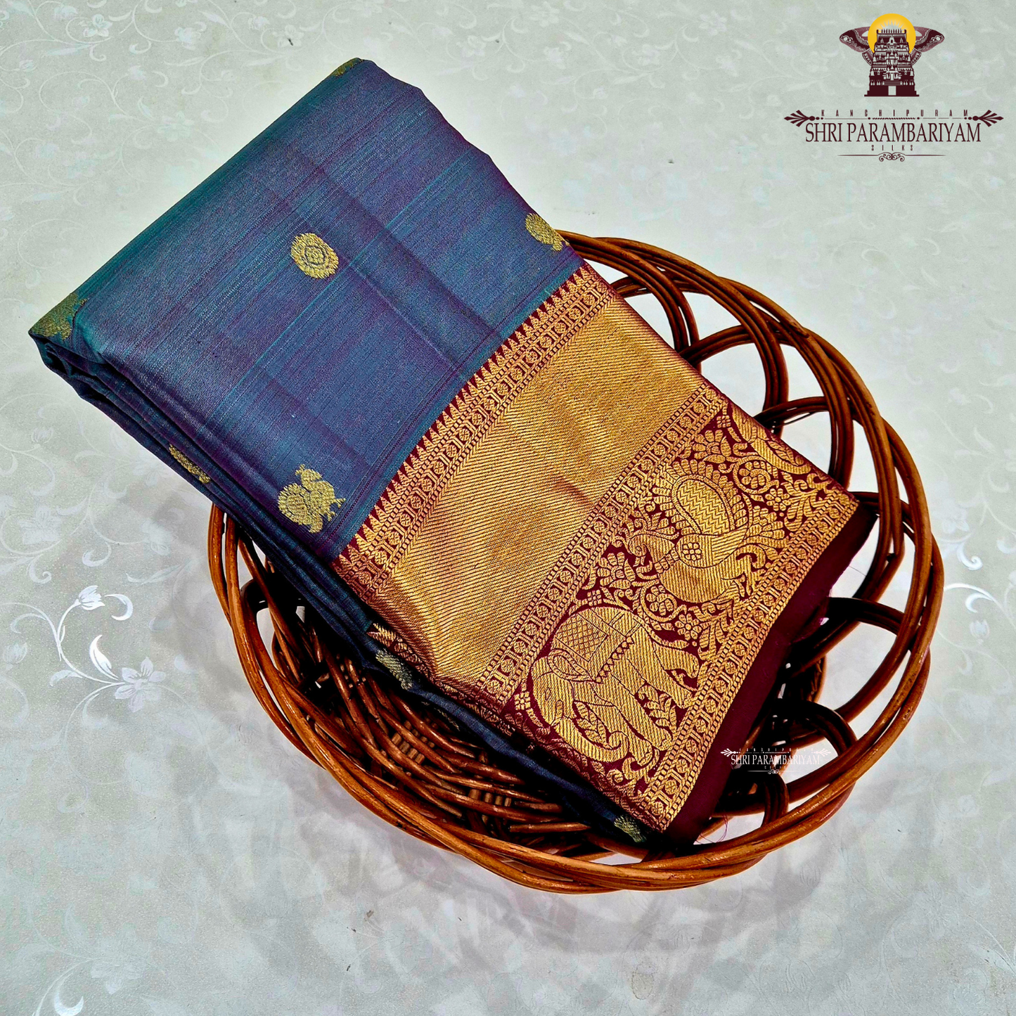 A rich dual-tone blend of deep peacock blue and violet (iridescent shade) body with a contrast Saree