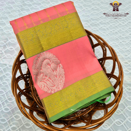 A beautiful coral pink (peach-pink) shade, elegantly enhanced Saree