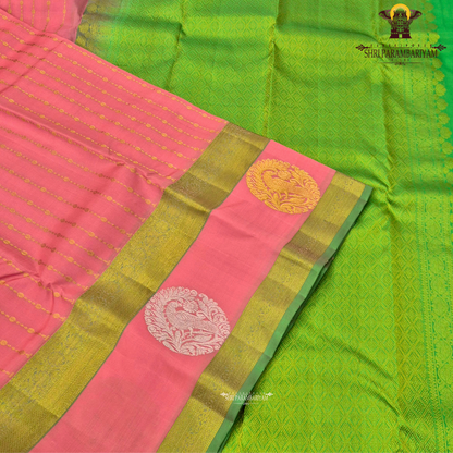 A beautiful coral pink (peach-pink) shade, elegantly enhanced Saree