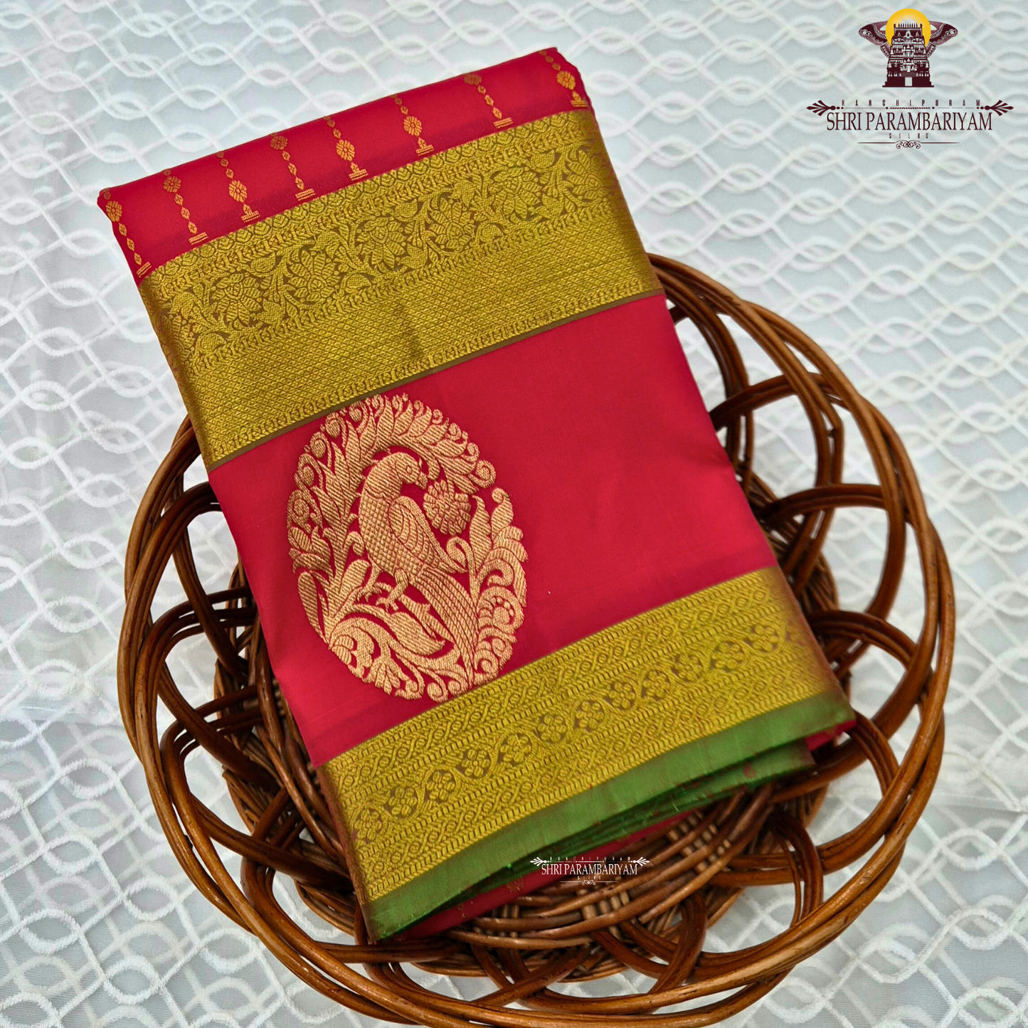A vibrant Tomato red shade, radiating richness and festive elegance Saree