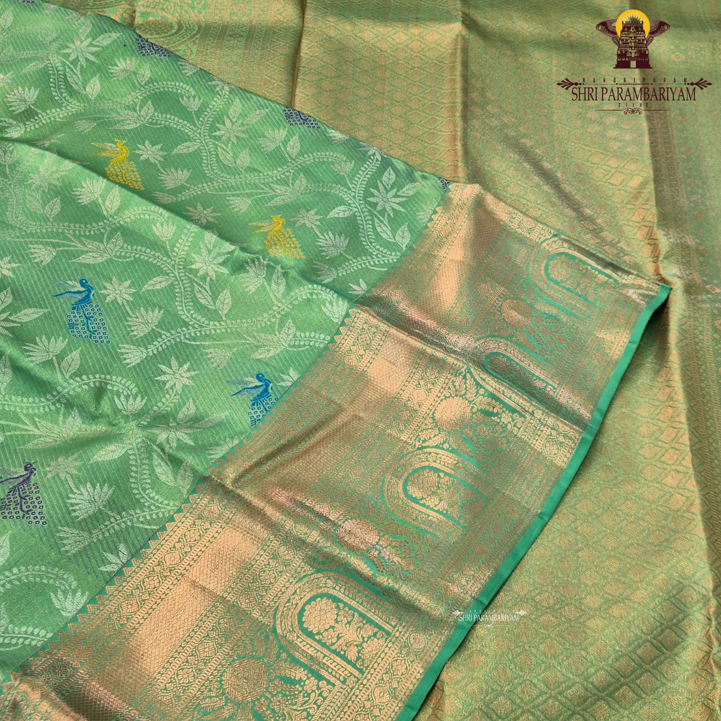 A refreshing parrot green / leaf green base with rich antique gold zari work Saree