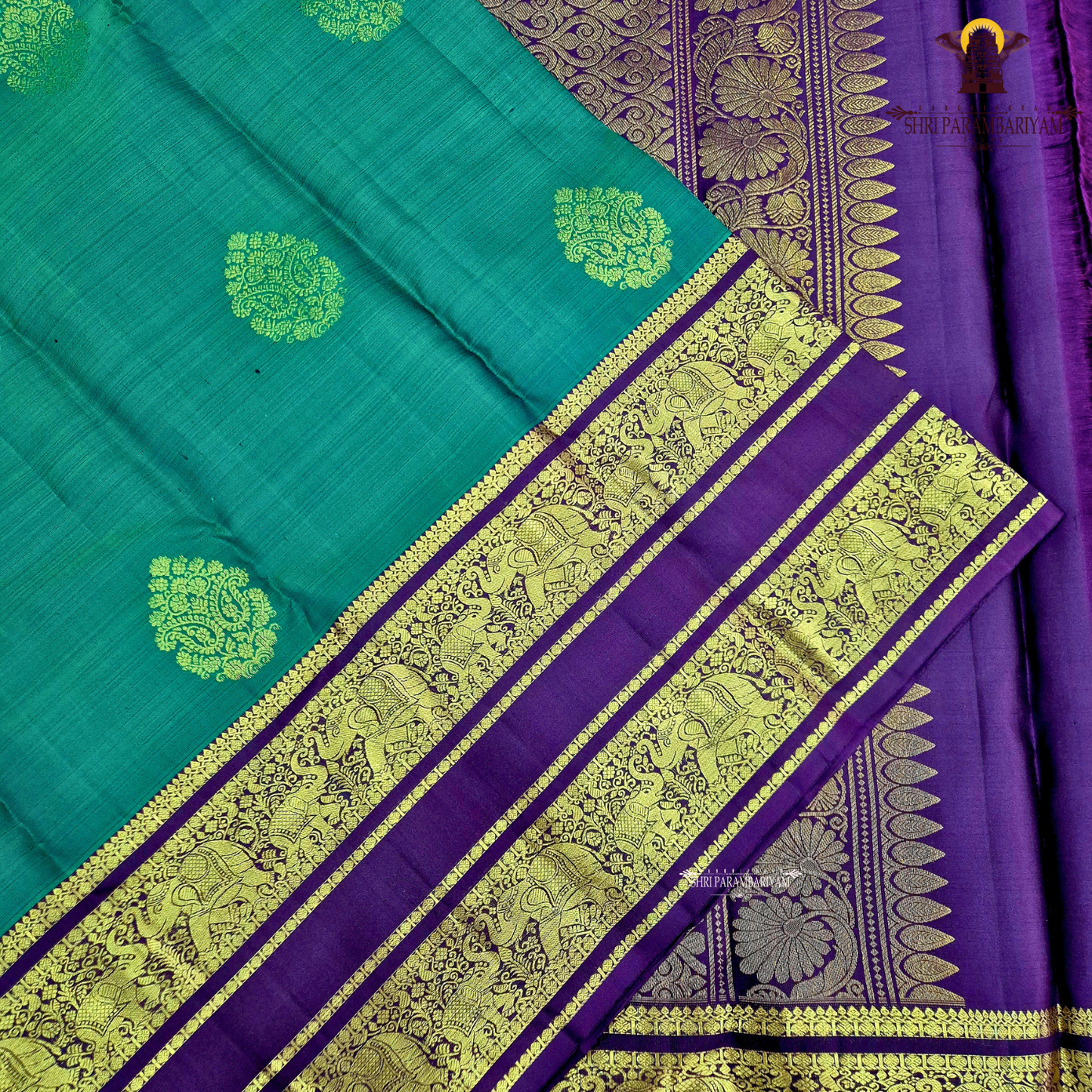 A rich Emerald Green with Royal Purple Border Saree