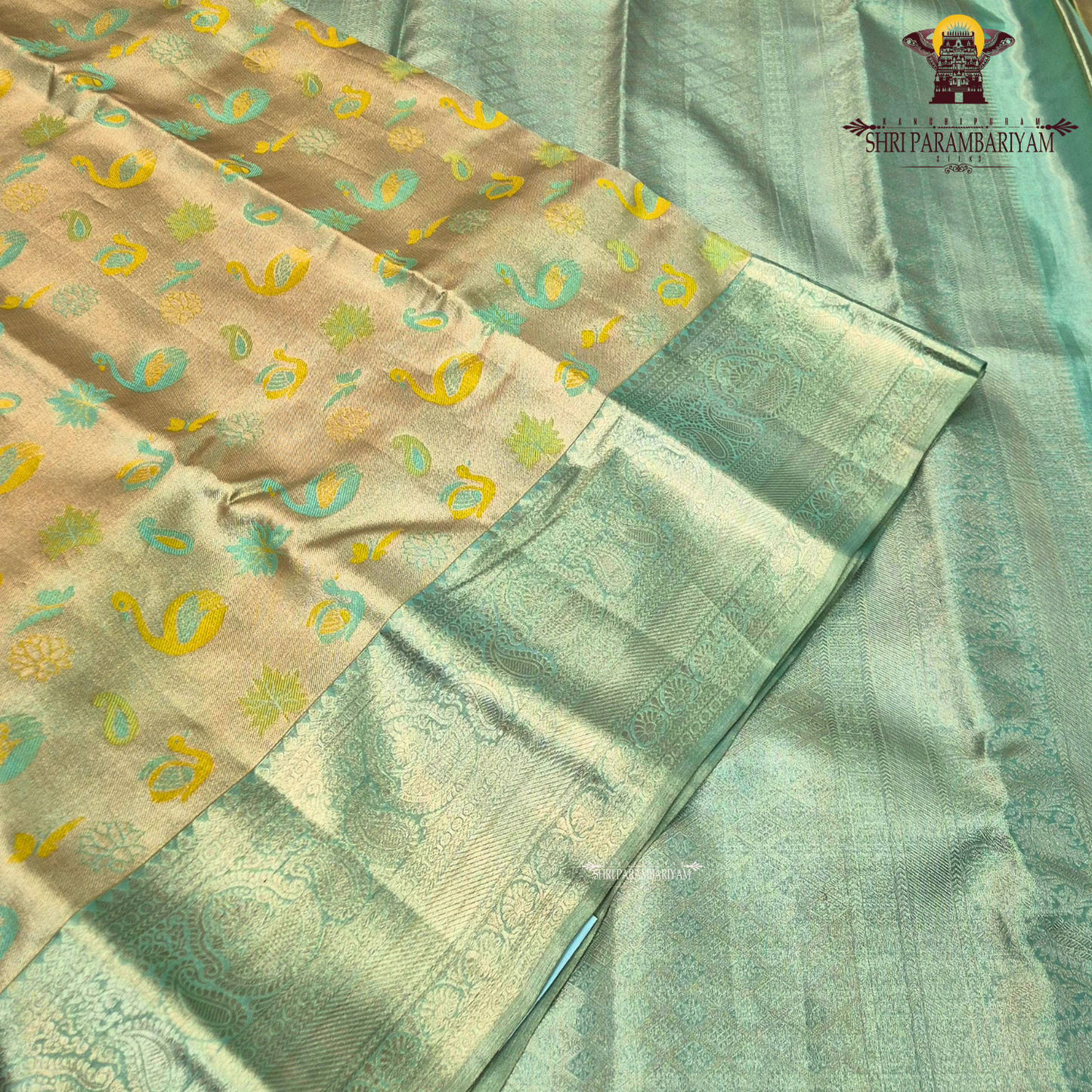 A soft and elegant pastel sea green / mint green tissue base Saree