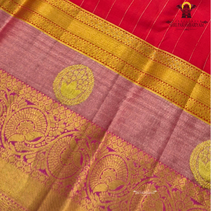 A vibrant reddish pink (vermilion red) body beautifully complemented Saree