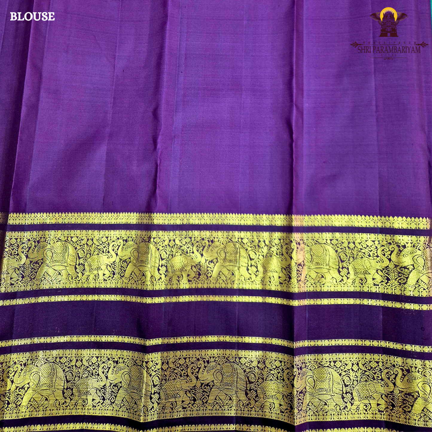 A rich Emerald Green with Royal Purple Border Saree