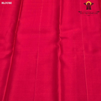 A vibrant bridal red color complemented by rich gold zari weaving Saree