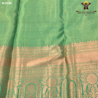 A refreshing parrot green / leaf green base with rich antique gold zari work Saree