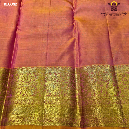 Bright rose pink (rani pink shade) with a rich gold zari border highlighted by a soft orange edging Saree