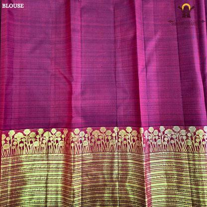 A vibrant Ruby Red shade, elegantly adorned with traditional gold zari buttas Saree