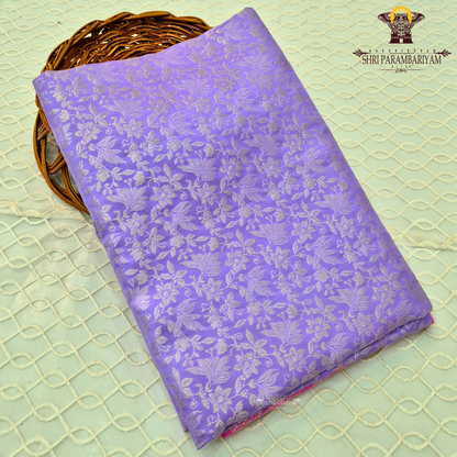A rich lavender purple (soft violet tone) base with elegant silver zari work Saree