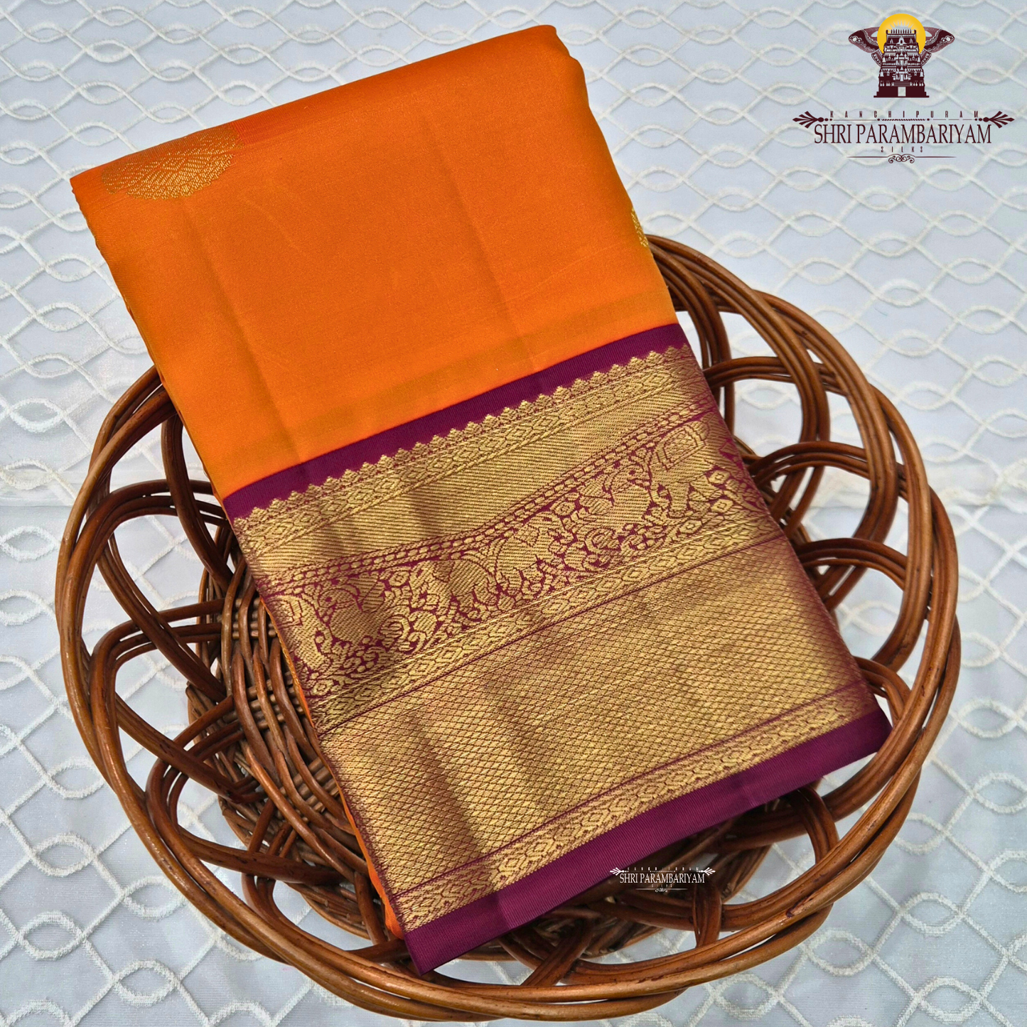 A bright and striking orange body adorned with a subtle Saree