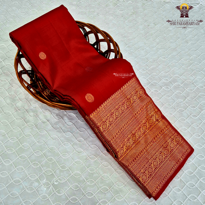 A vibrant Classic Vermilion Red / Bridal Red shade, beautifully complemented Saree