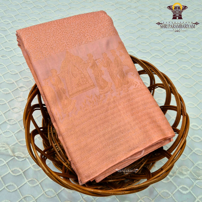 A soft peachy rose (muted bridal pink) shade with a warm undertone—an elegant Saree