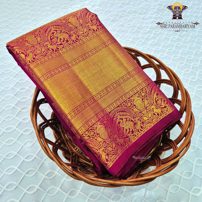 A rich Magenta / Rani Pink with Antique Gold Zari Saree
