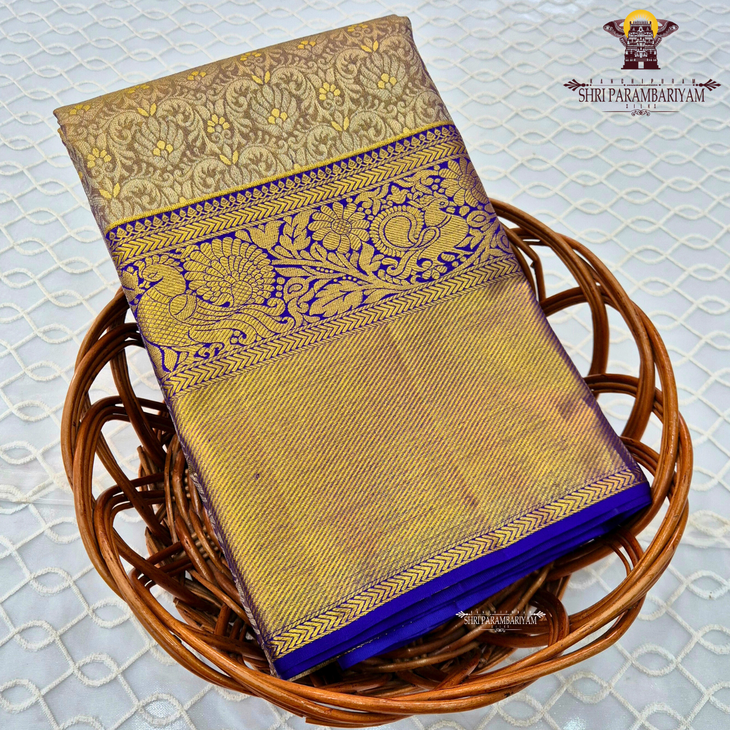 Elegant antique gold / muted gold with a rich royal blue border Saree