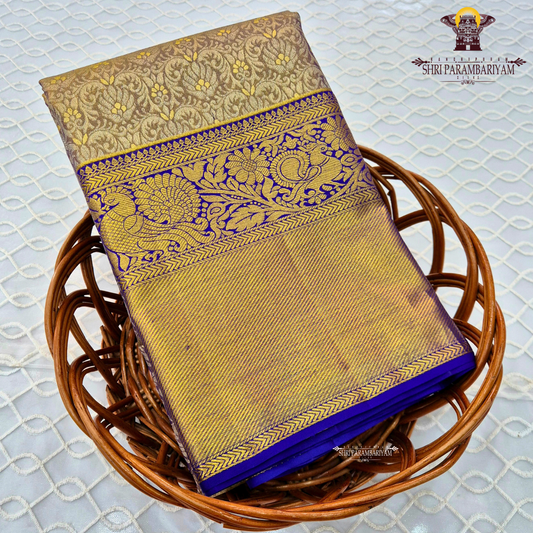 Elegant antique gold / muted gold with a rich royal blue border Saree