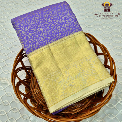 A rich royal violet/purple body paired with a lustrous gold zari Saree