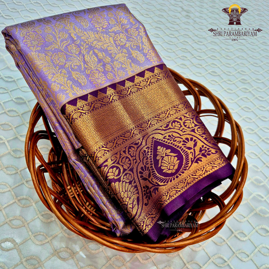 Rich lavender purple with an elegant gold zari sheen Saree