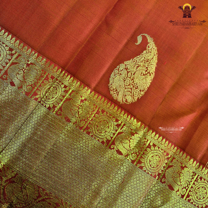 A radiant Vermilion Orange shade, beautifully highlighted with an exquisite gold zari Saree