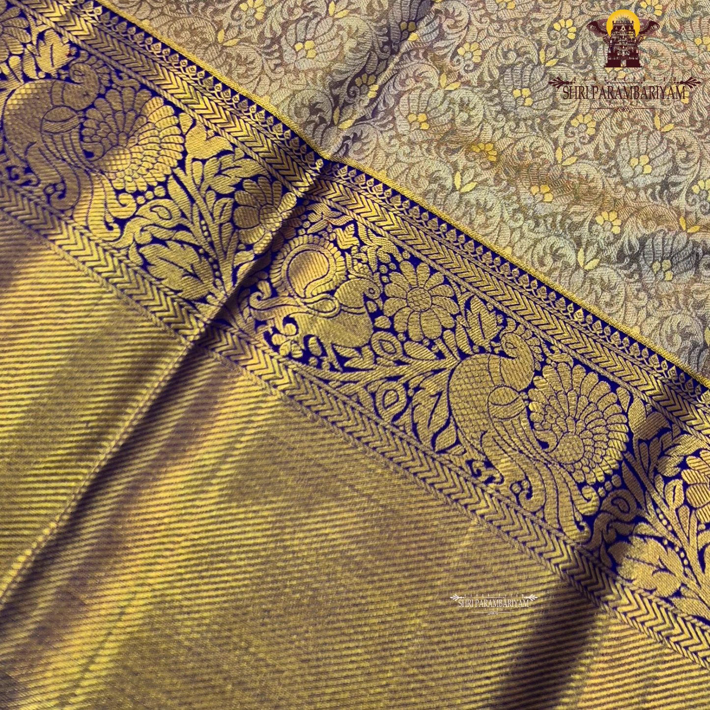 Elegant antique gold / muted gold with a rich royal blue border Saree