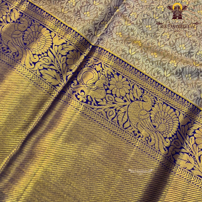 Elegant antique gold / muted gold with a rich royal blue border Saree