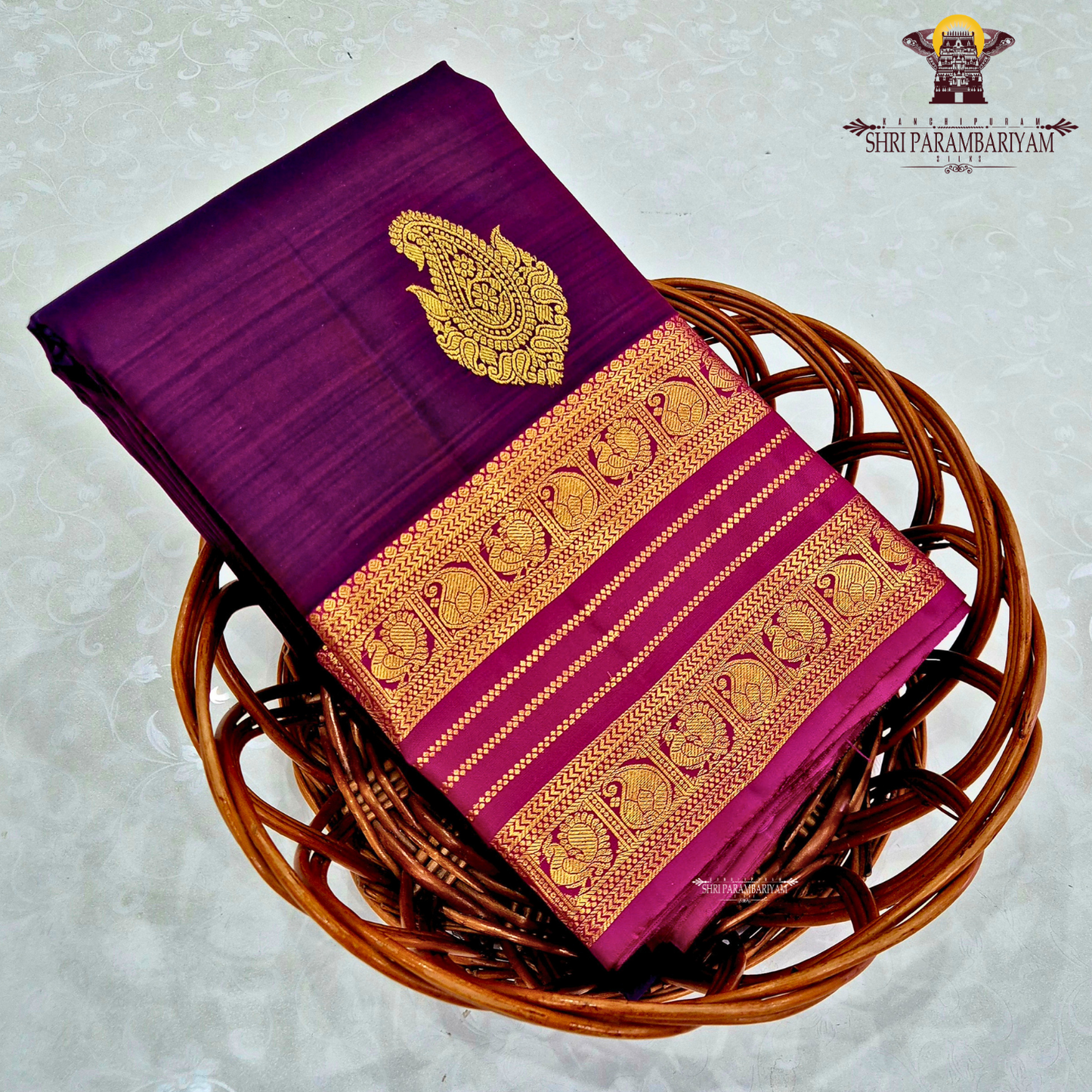 A rich dual-tone deep wine purple with magenta undertones Saree